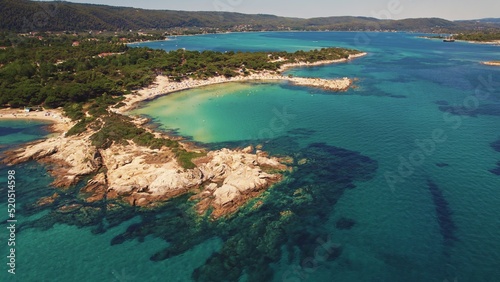 Naturally stunning Karydi beach in Greece surrounded by shallow see-through not polluted sea water. Aerial shot. High quality photo © PoppyPix