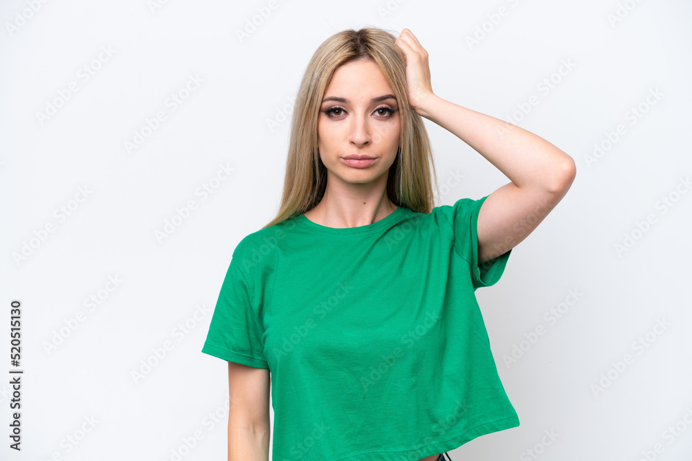 Pretty blonde woman isolated on white background with an expression of frustration and not understanding