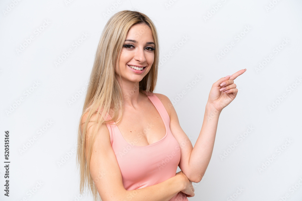 Pretty blonde woman isolated on white background pointing finger to the side Pretty blonde woman isolated on white background pointing finger to the side