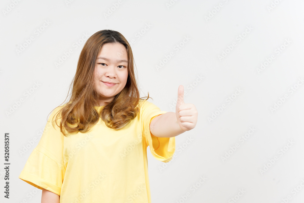 Smile and Showing thumbs up of Beautiful Asian Woman wearing yellow T-Shirt Isolated On White Smile and Showing thumbs up of Beautiful Asian Woman wearing yellow T-Shirt Isolated On White