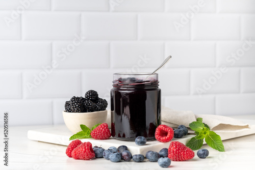 Quadro su tela Homemade berry jam in glass jar . preserves for winter