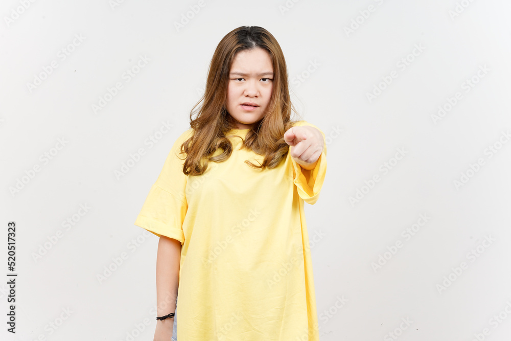 Angry expression and Pointing at camera of Beautiful Asian Woman wearing yellow T-Shirt