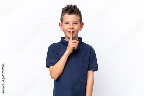 Little caucasian boy isolated on white background showing a sign of silence gesture putting finger in mouth