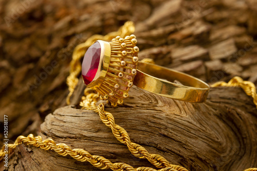 Gold ring with red stone. Necklace