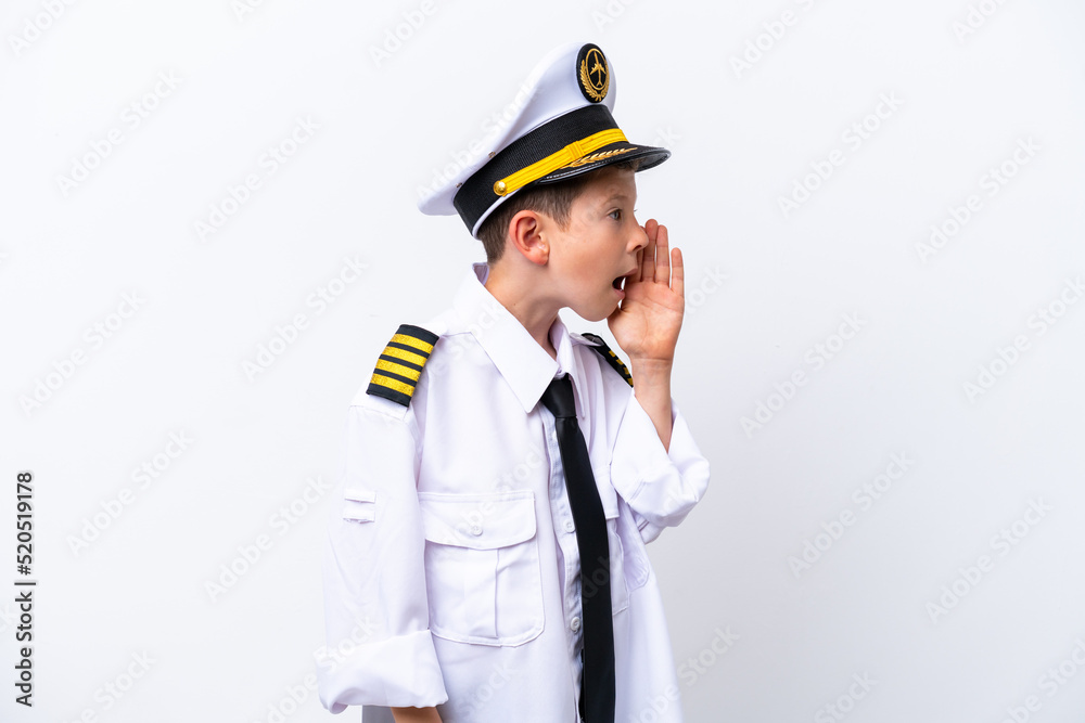 Little airplane pilot boy isolated on white background shouting with mouth wide open to the side