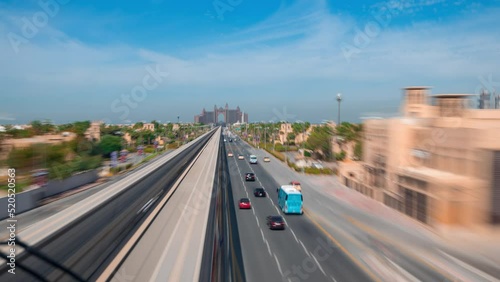 Dubai / UAE-TimeLapse video of  Palm Jumeirah island viewed from Monorail train in high speed hyperlapse video. photo