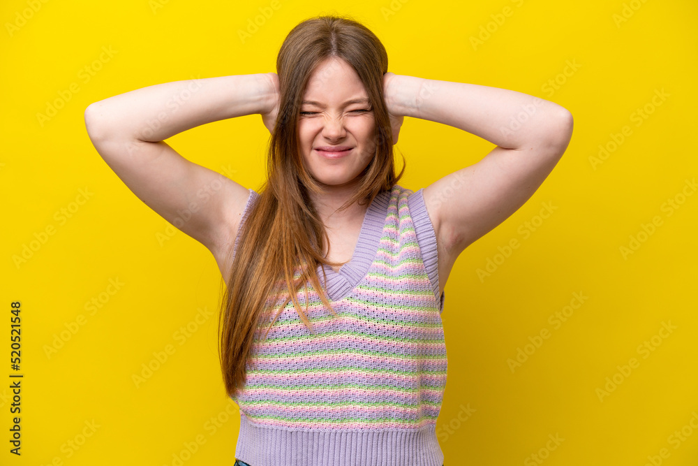 Young caucasian woman isolated on yellow background frustrated and covering ears Young caucasian woman isolated on yellow background frustrated and covering ears