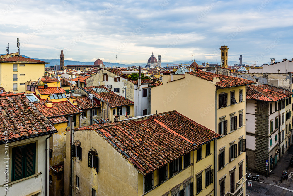 The cityscape of Florence rooftops with the Duomo - Santa Maria del Fiore in distance.