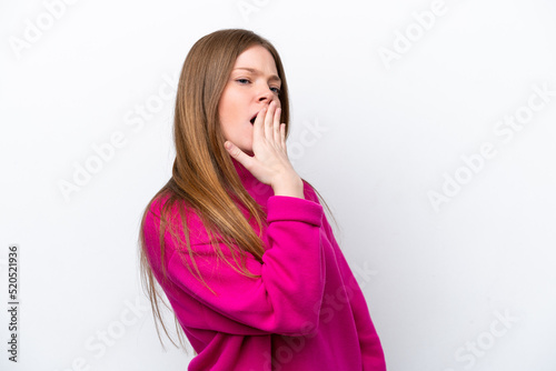 Young caucasian woman isolated on white background yawning and covering wide open mouth with hand