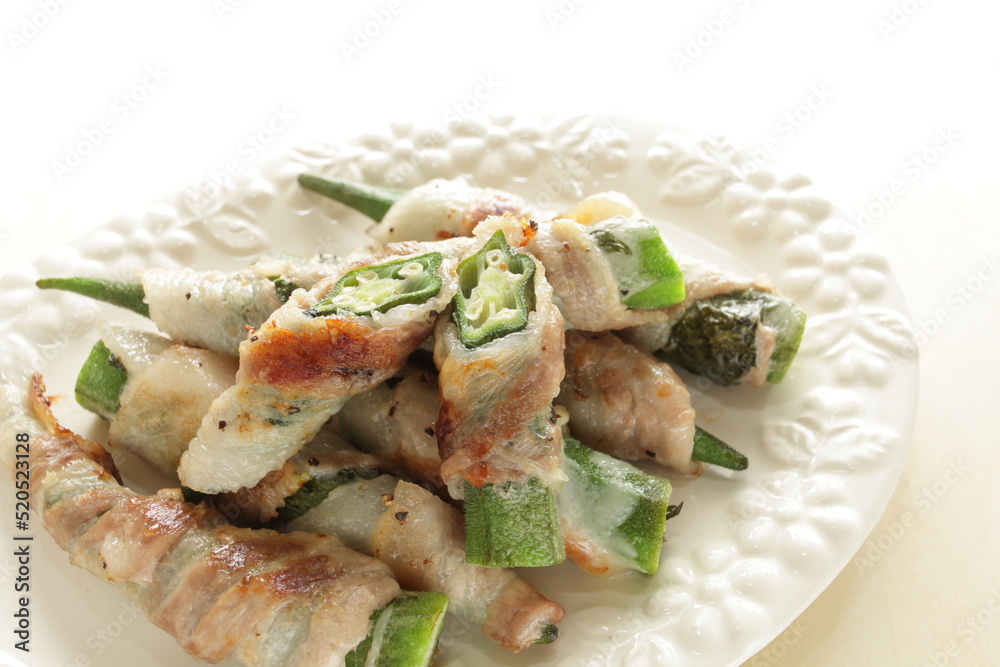 Asian food, Okra and belly pork roll fried with copy space Asian food, Okra and belly pork roll fried with copy space