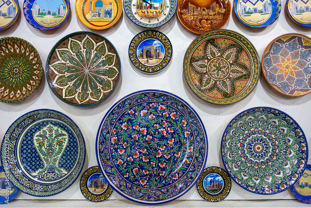 Decorative ceramic plates with traditional Uzbek ornaments in the Samarkand market. Uzbekistan