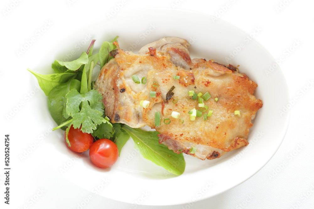 Homemade grilled chicken served with baby leaves and cherry tomato salad Homemade grilled chicken served with baby leaves and cherry tomato salad