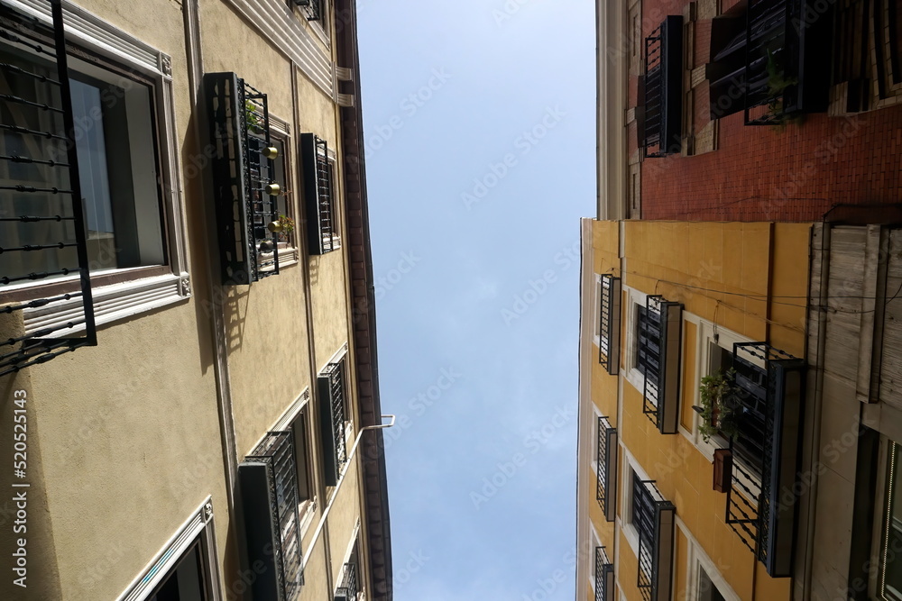 Street view looking up at apartment block in city Madrid. Traditional architecture of Madrid, Spain Street view looking up at apartment block in city Madrid. Traditional architecture of Madrid, Spain
