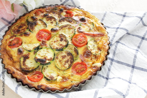Homemade zucchini and cherry tomato with bacon quiche