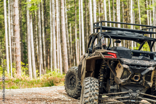 UTV in the woods dirty from mud