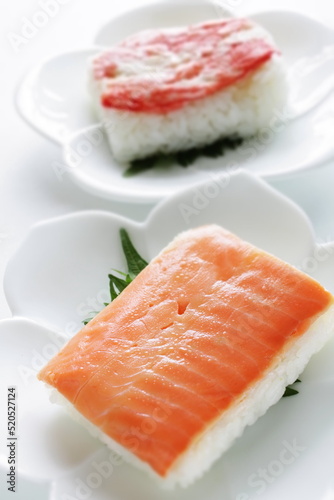 Japanese food, salmon fish Press sushi on white dish 