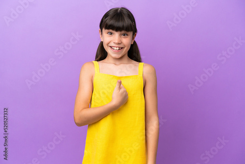 Little caucasian kid isolated on purple background with surprise facial expression