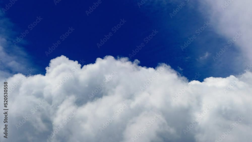 Clouds puffy are moving across the blue sky. Ultra HD scenery of cloud in motion. Clouds puffy are moving across the blue sky. Ultra HD scenery of cloud in motion.