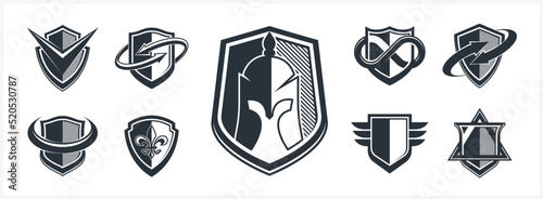 Classic shields shapes set with different additional elements vector symbols set, defense and safety icons, ammo emblems collection.
