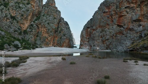 Beautiful 4k aerial view of Sa Calobra beach in Mallorca, Soller, Serra de Tramuntana mountain landscape in Balearic Islands, Spain.