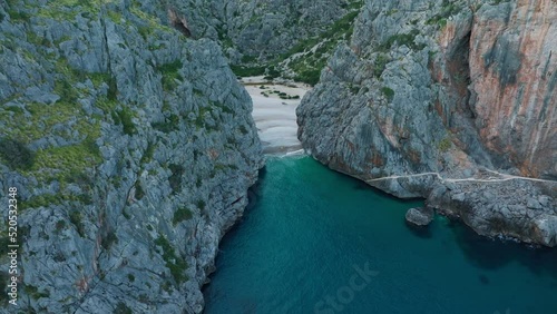 Beautiful 4k aerial view of Sa Calobra beach in Mallorca, Soller, Serra de Tramuntana mountain landscape in Balearic Islands, Spain.