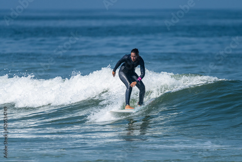 Surfer girl riding a wave