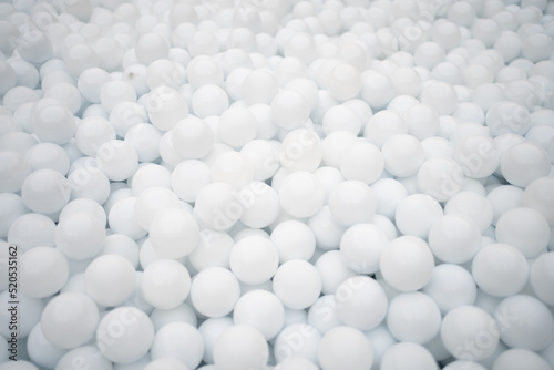 Many white plastic balls for dry pool.