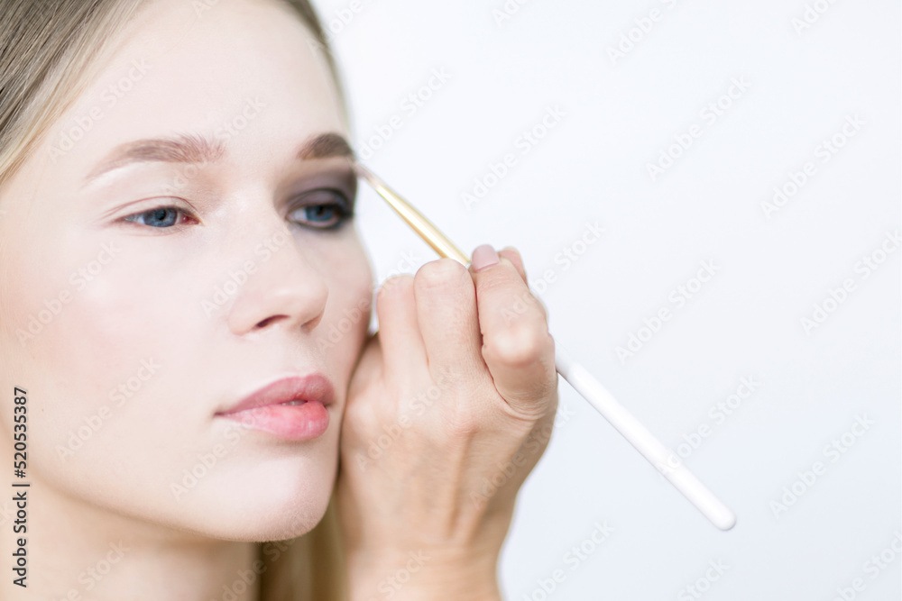 Eye makeup close-up. Makeup artist applies eye shadow models. Eye makeup close-up. Makeup artist applies eye shadow models.