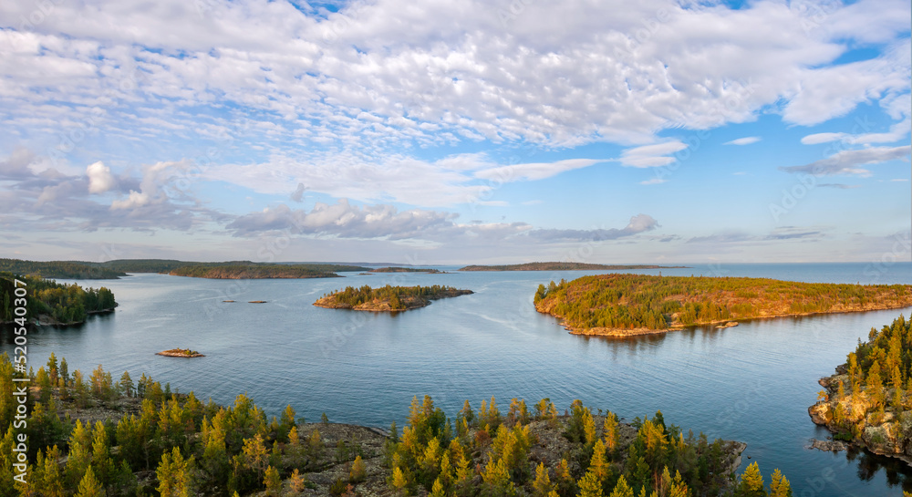 Republic Karelia. Lake Ladoga in Russia. Karelia from birds eye view. Landscape of northern nature on summer day. Panorama Ladoga Islands. Coniferous trees grow on rocks. Journey to Russians Karelia