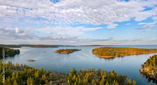 Republic Karelia. Lake Ladoga in Russia. Karelia from birds eye view. Landscape of northern nature on summer day. Panorama Ladoga Islands. Coniferous trees grow on rocks. Journey to Russians Karelia photo