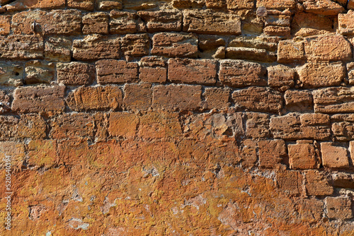 Texture of old stone wall in brown color
