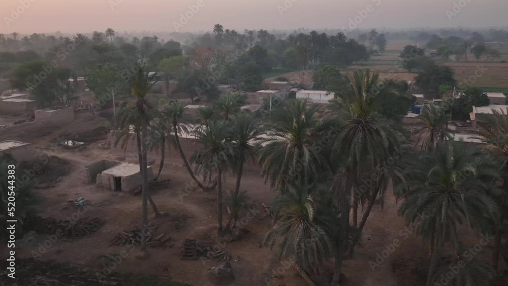 Aerial Drone Flying Over Local Rural Village In Punjab With Dusty Orange Sky Aerial Drone Flying Over Local Rural Village In Punjab With Dusty Orange Sky