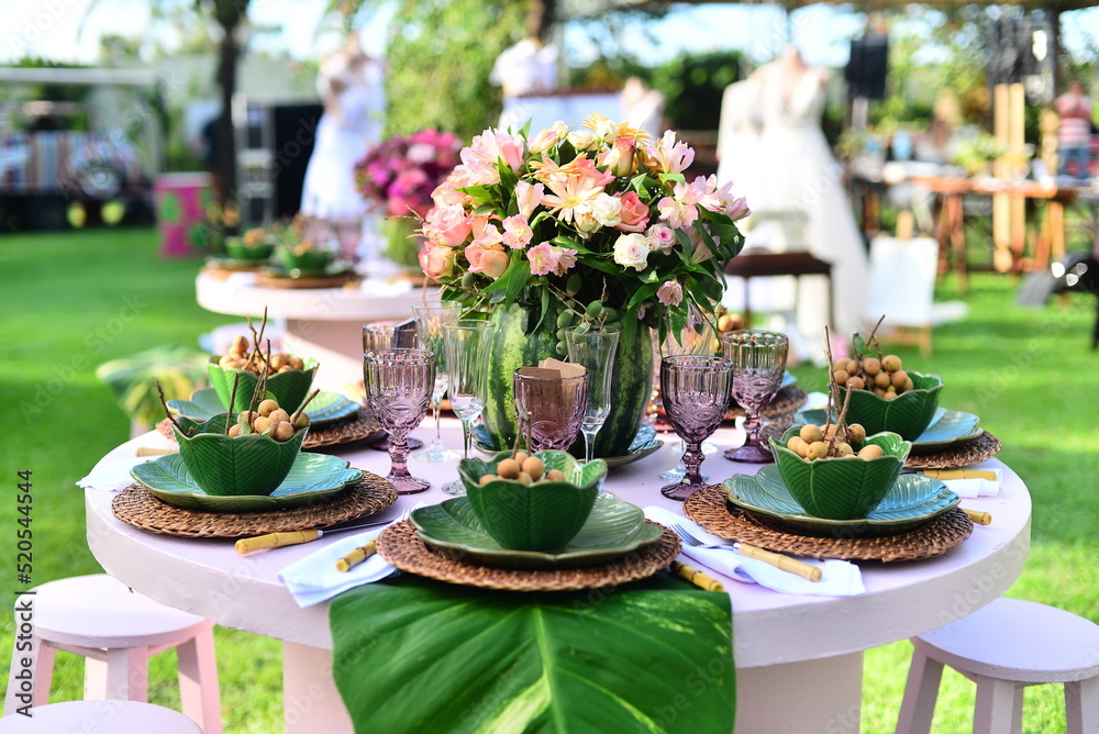 table set with flowers and pitombas regional fruits, ornamental flowers table set with flowers and pitombas regional fruits, ornamental flowers