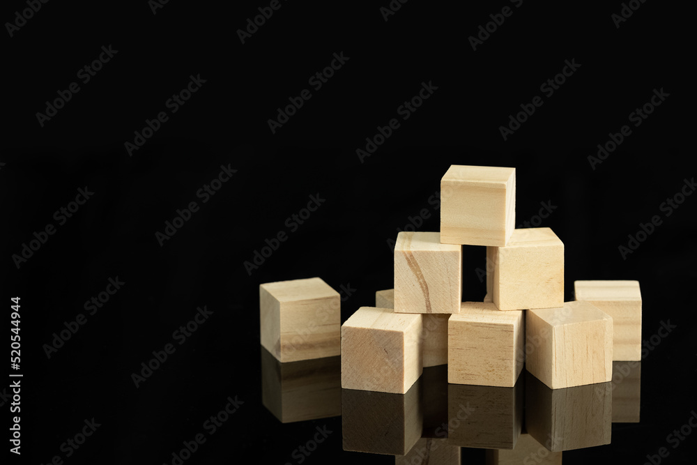 wood cube block puzzle on black background wood cube block puzzle on black background