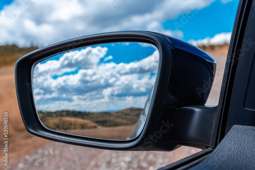 Car Mirror Close up On a Country Road © bennian_1