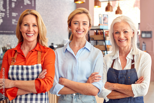 Portrait Of Female Owner And Staff Working In Coffee Shop Or Restaurant
