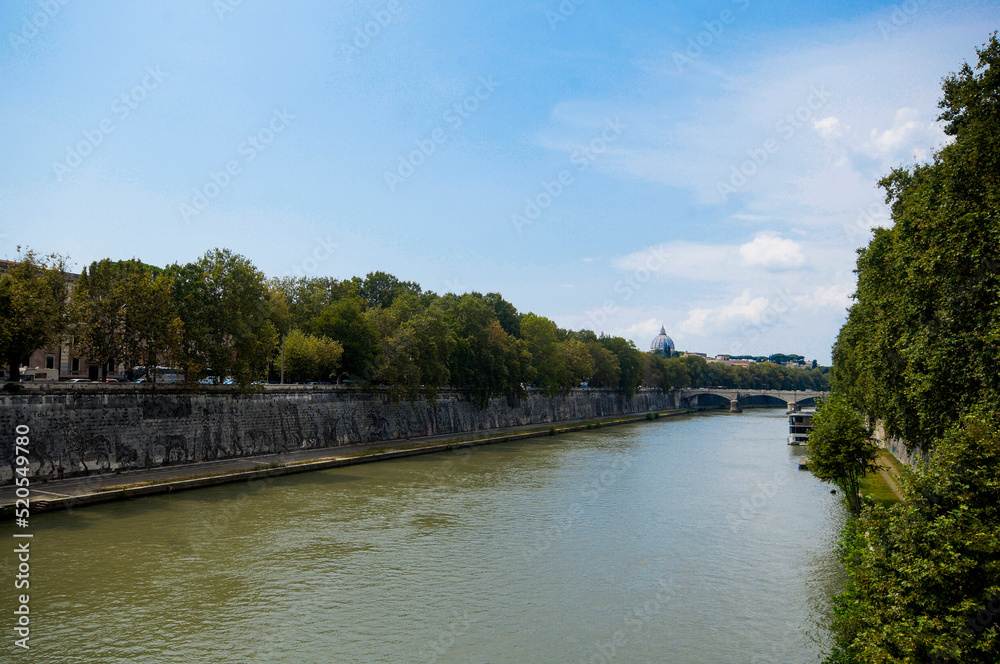 Photo of the bridge Ponte Principe Amedeo Savoia Aosta in Rome city, across the Tiber River. View of church Chiesa Parrocchiale di San Giovanni Battista dei Fiorentini