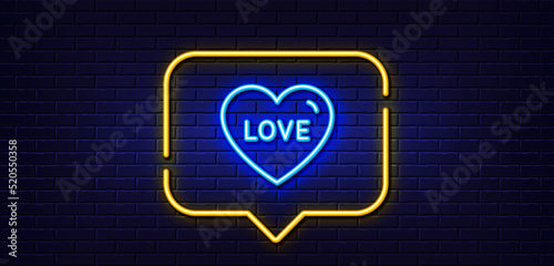 Neon light speech bubble. Love line icon. Sweet heart sign. Valentine day symbol. Neon light background. Love glow line. Brick wall banner. Vector