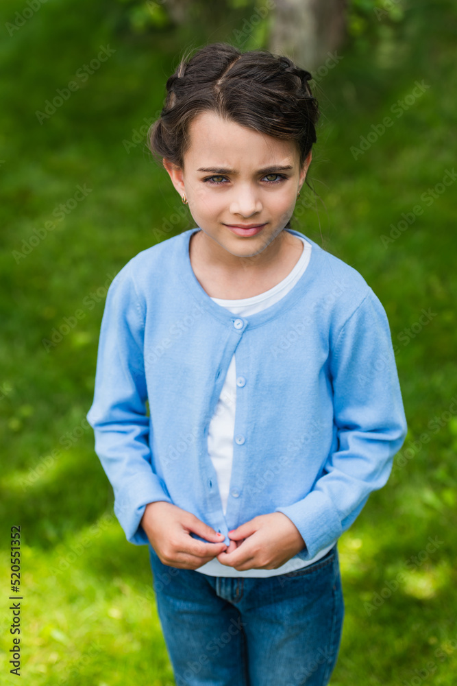 upset ukrainian child looking at camera outdoors upset ukrainian child looking at camera outdoors