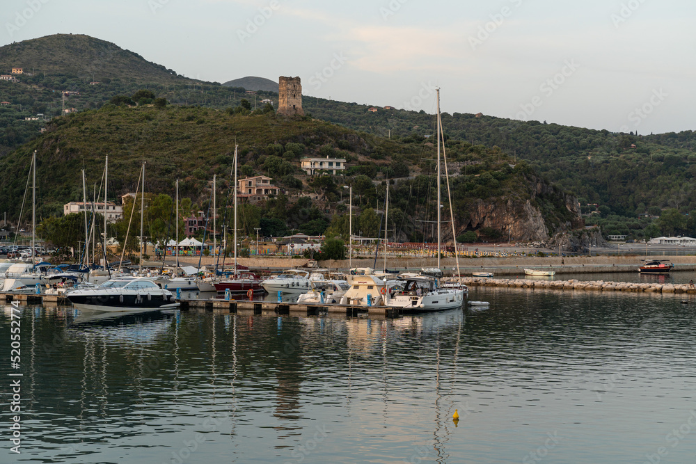 View of Marina di Camerota port and waterfront at sunset, Campania, Italy
