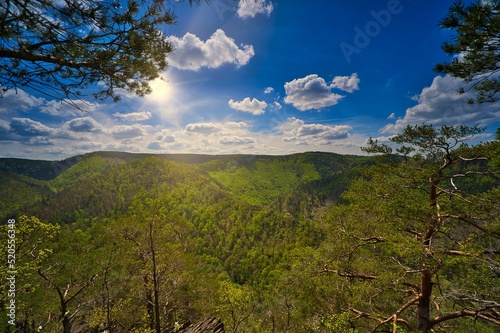 Scenic landscape with the green Thuringian Forest on the mountains under the sunlight photo