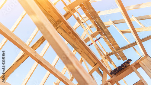 House roof carcass made of boards at construction site