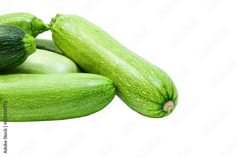fresh zucchini on a white background. delicious green vegetables on the table. appetizing zucchini on a light texture. healthy food concept fresh zucchini on a white background. delicious green vegetables on the table. appetizing zucchini on a light texture. healthy food concept