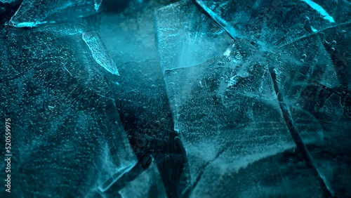 Blue ice breaks in slow motion photo