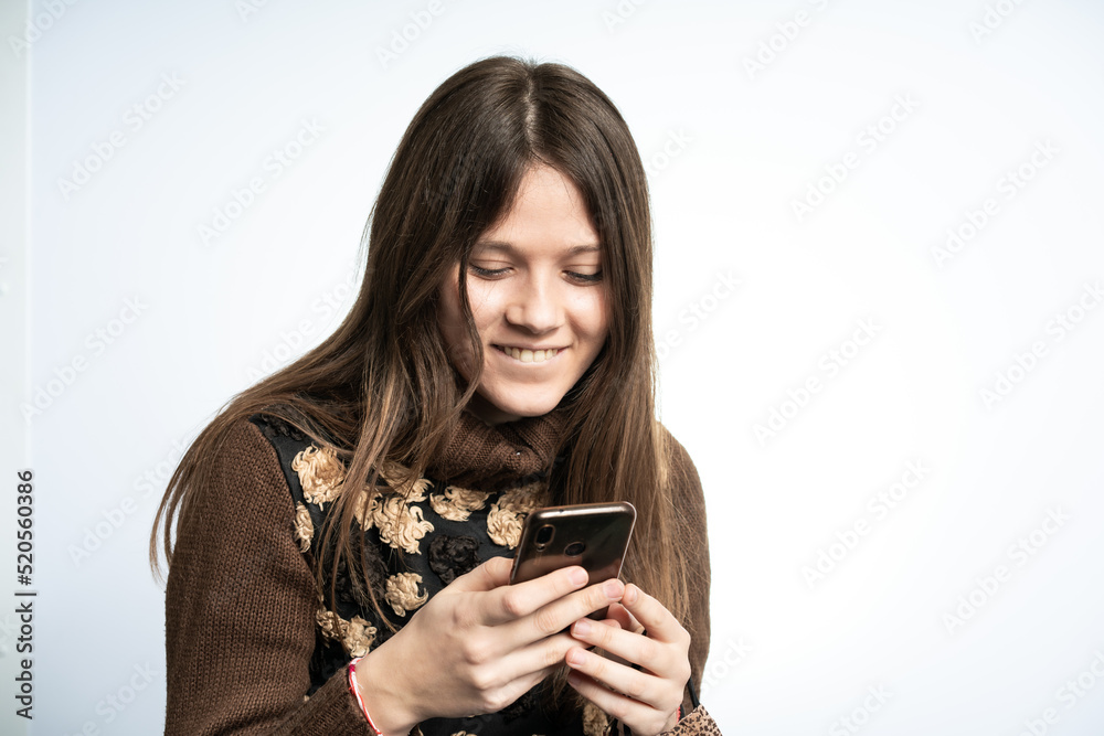 Young beautiful woman is having fun with smartphone Young beautiful woman is having fun with smartphone