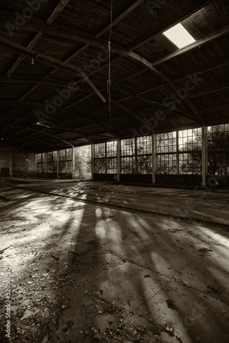   Old abandoned factory building or warehouse on sunny summer day