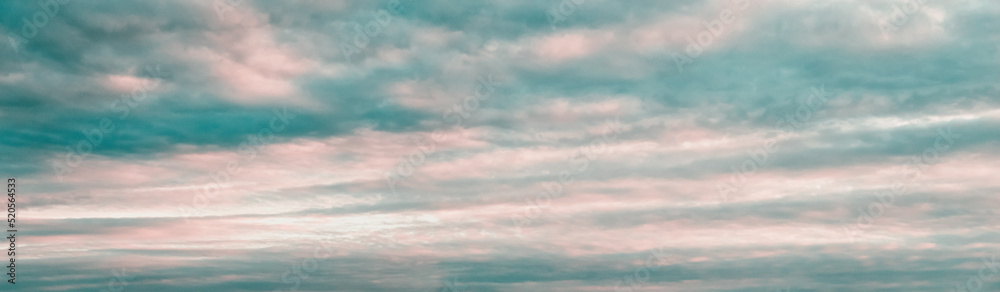 Sunset sky panorama, pink blue clouds background, cloudscape, wide large banner size