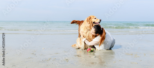 Friendly pets, The woman and golden retriever family rest on tropical beach