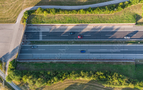 German highway coming out of tunnel seen from above near Munich with car traffic