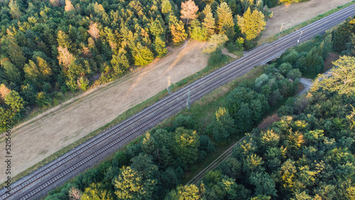 Train tracks through German forest near Munich aerial drone view fotage photo